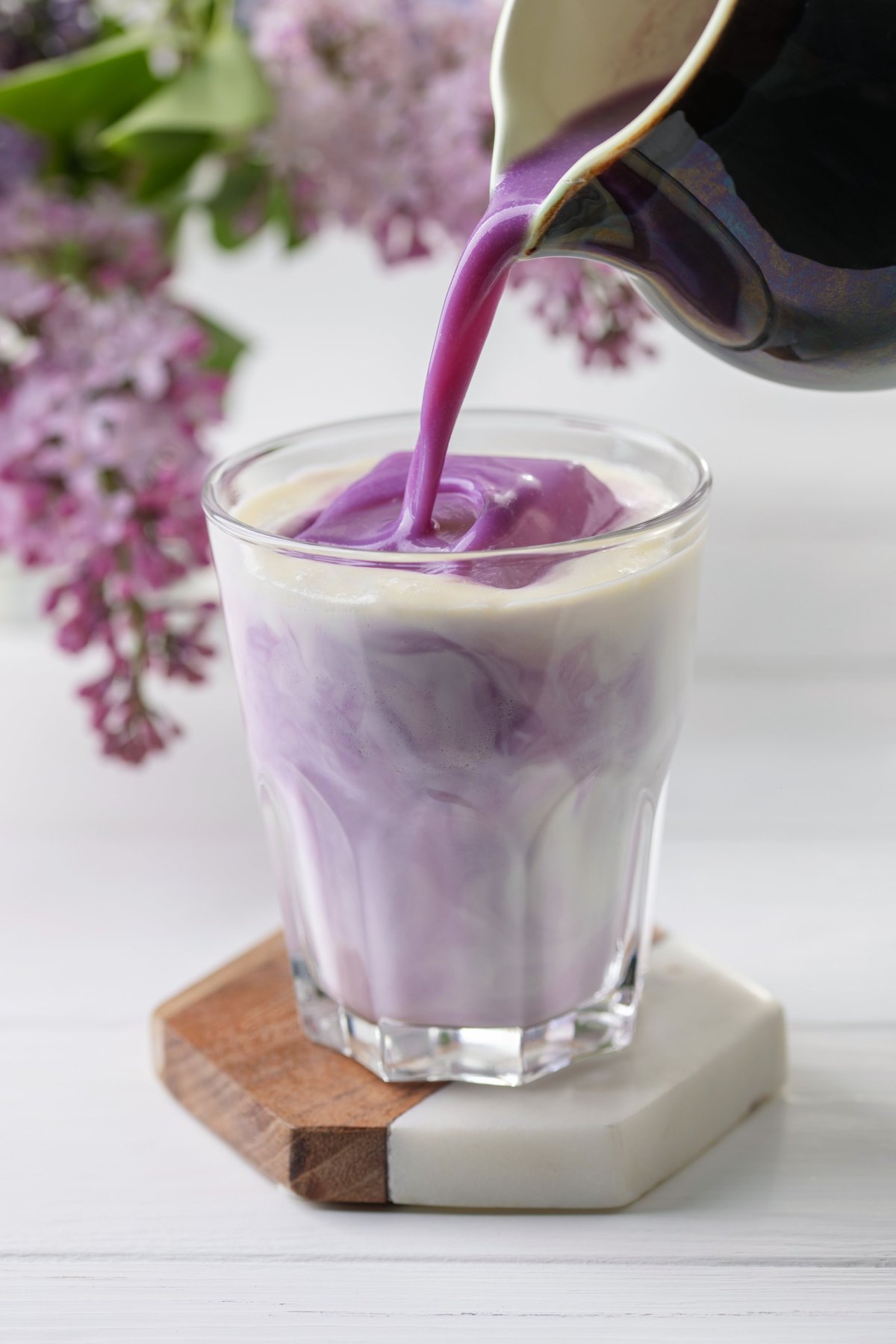 Ube latte in a glass, a vibrant Asian drink